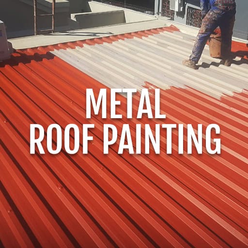 Metal roof being painted with red and white colors by professionals.